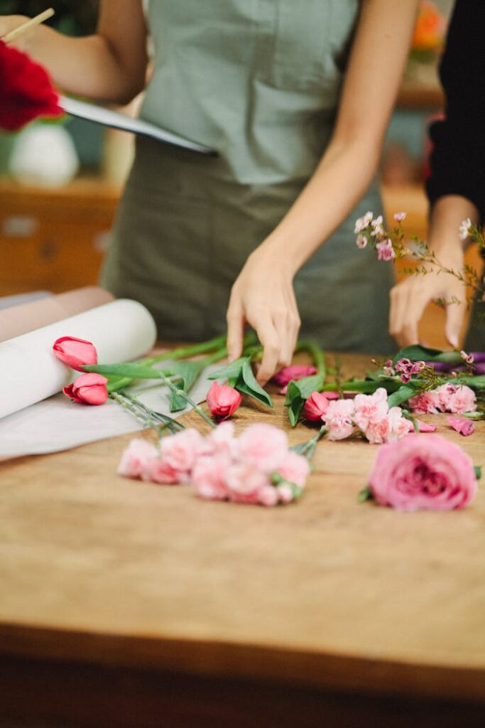 pexels-photo-5410057 Crop florists making floral arrangement